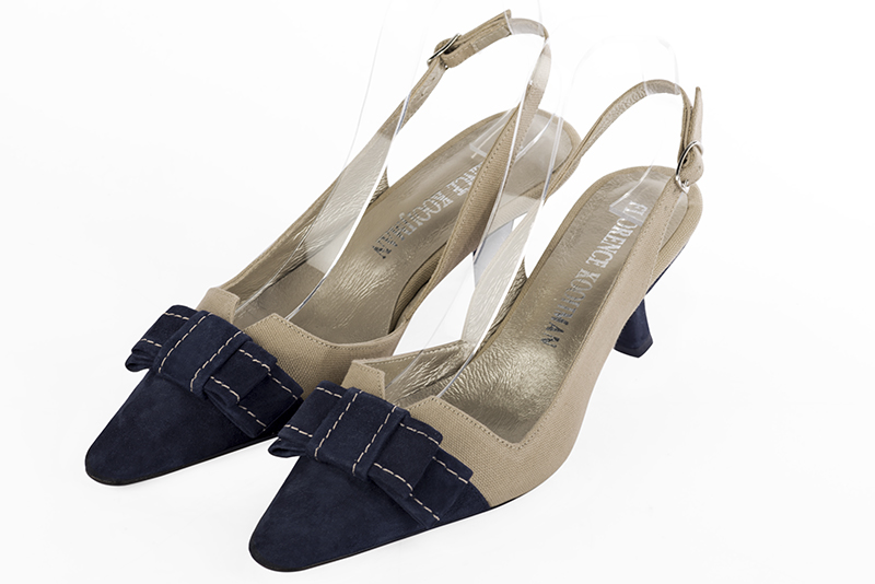 Navy blue and tan beige women's open back shoes, with a knot. Tapered toe. Medium spool heels. Front view - Florence KOOIJMAN